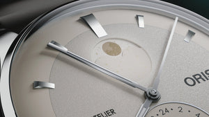 Close-up of a watch face with visible brand name