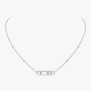 Silver necklace with small diamonds on a light gray background