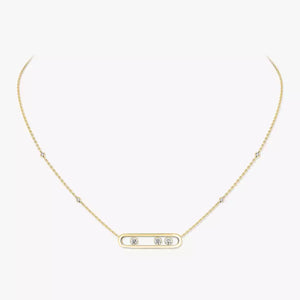 Gold necklace with small diamonds on a white background