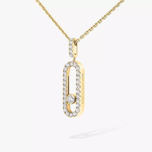 Gold necklace with a diamond pendant on a white background
