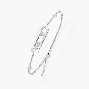 Silver bracelet with diamond accents on a white background