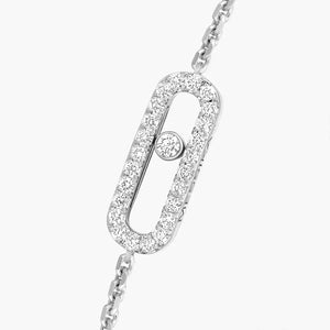 Close-up of 0.20ctw white gold diamond pave bracelet showing oval pave link with center bezel diamond
