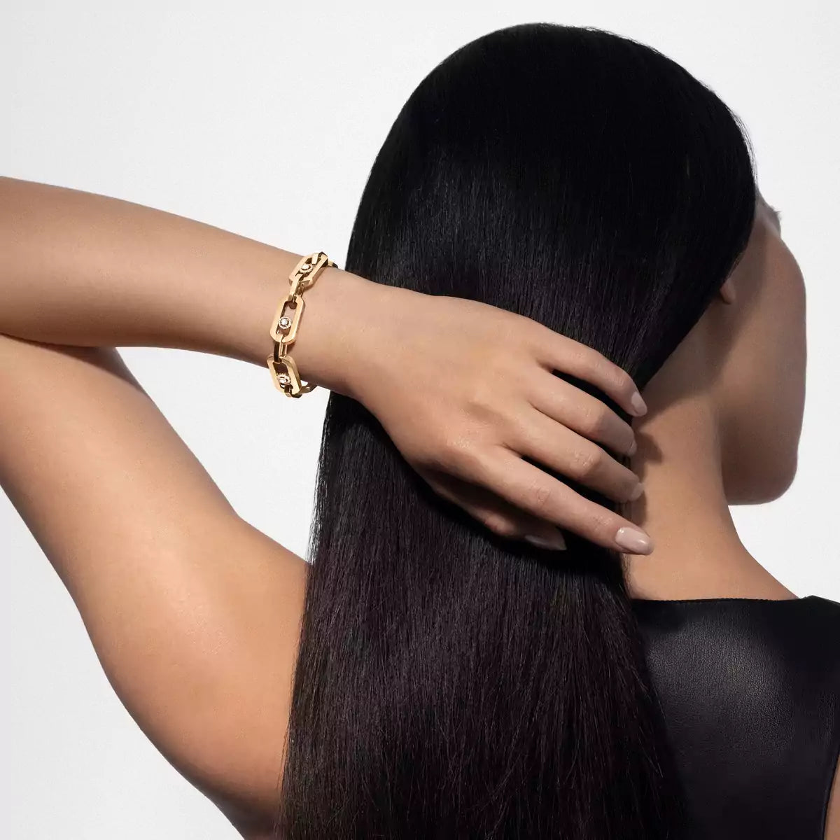 Back view of 0.40ctw Yellow Gold Diamond Link Bracelet on model’s wrist showing sculptural gold links with moving diamonds