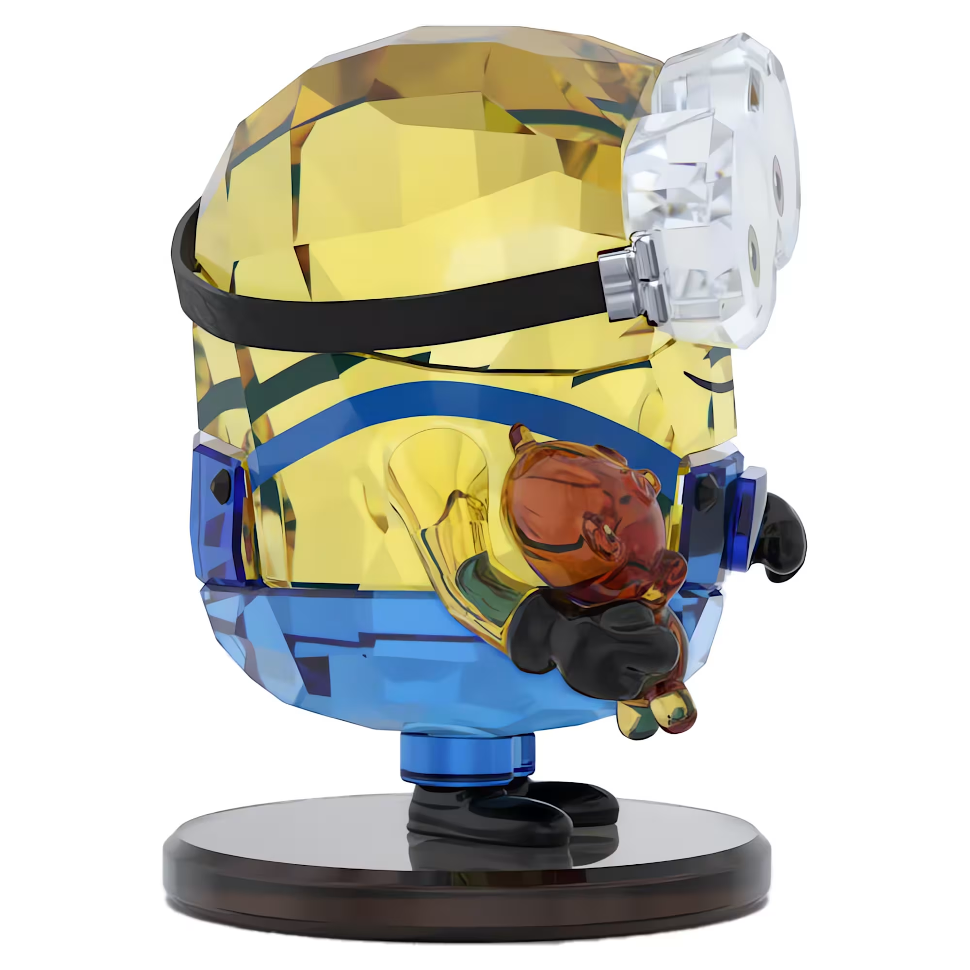 Three-quarter view of Minions Bob crystal figurine showing faceted yellow-and-blue body holding brown teddy on black base