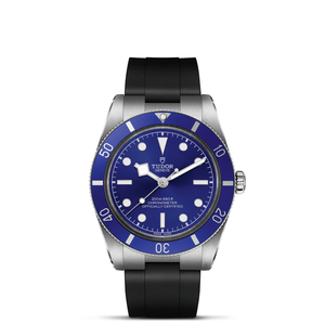 Front view of TUDOR Black Bay 54 watch showcasing blue domed dial and black rubber strap on white background