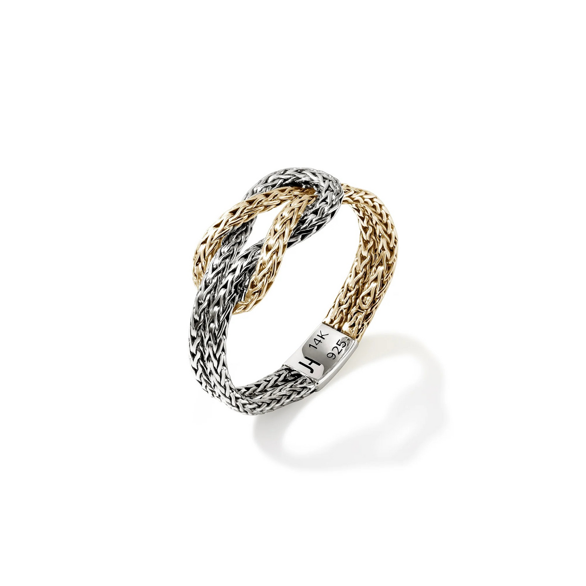 Close-up of Love Knot ring featuring two-tone woven 14K reclaimed gold and sterling silver knot and 14K/925 stamp on white
