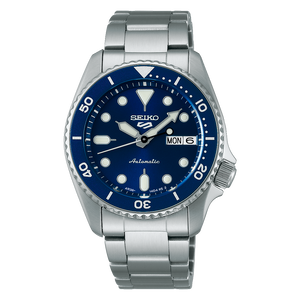 Seiko watch with blue dial and silver metal strap on a white background
