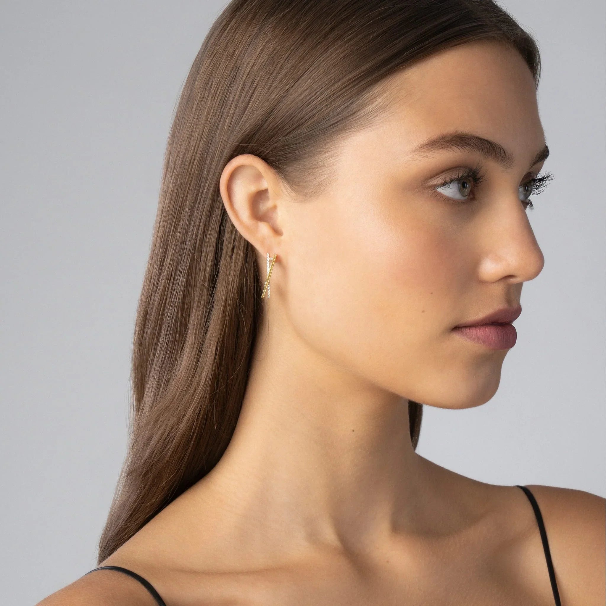 Right profile of Thin Two-Tone Caviar X Diamond hoop showing X-motif 18K gold caviar beading and diamonds on gray background