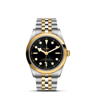 Front view of TUDOR Black Bay S&G 36mm watch with black dial, yellow-gold bezel and two-tone steel and gold bracelet