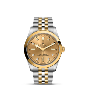 Front view of TUDOR Black Bay S and G 36 mm, champagne dial with diamond markers and two-tone steel and yellow gold bracelet