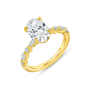 Angled view of 18K yellow gold engagement ring with oval 0.38ct diamond and diamond-accent twisted band on white background