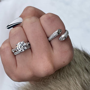Close-up of hand wearing Toi Et Moi 1.77ctw diamond ring in 18K white gold with round center and pear diamond accents on fur