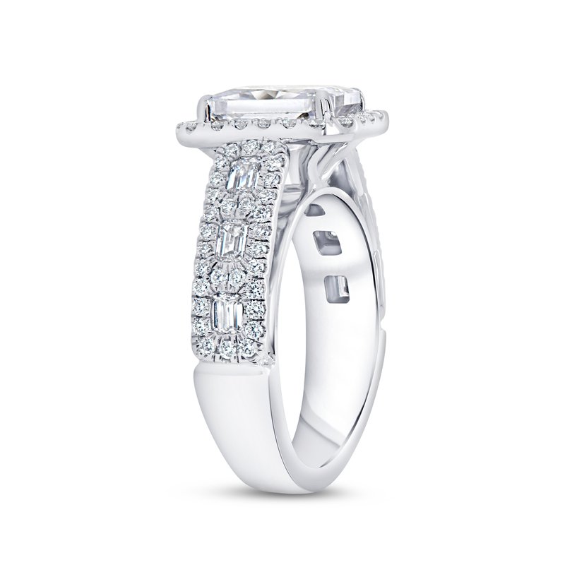 Side view of 1.19ctw emerald cut halo engagement ring showcasing its diamond halo on a white background