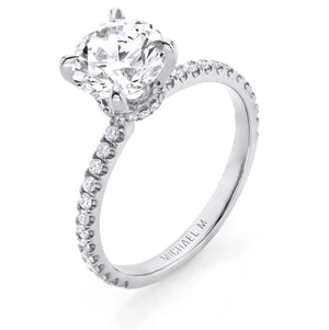 Solitaire engagement ring with pavé diamond band and round brilliant center stone, engraved MICHAEL M on inner shank.