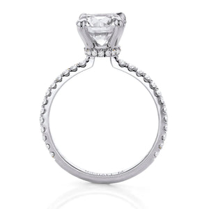 Platinum solitaire engagement ring with large round brilliant diamond in a prong setting and pavé diamond band