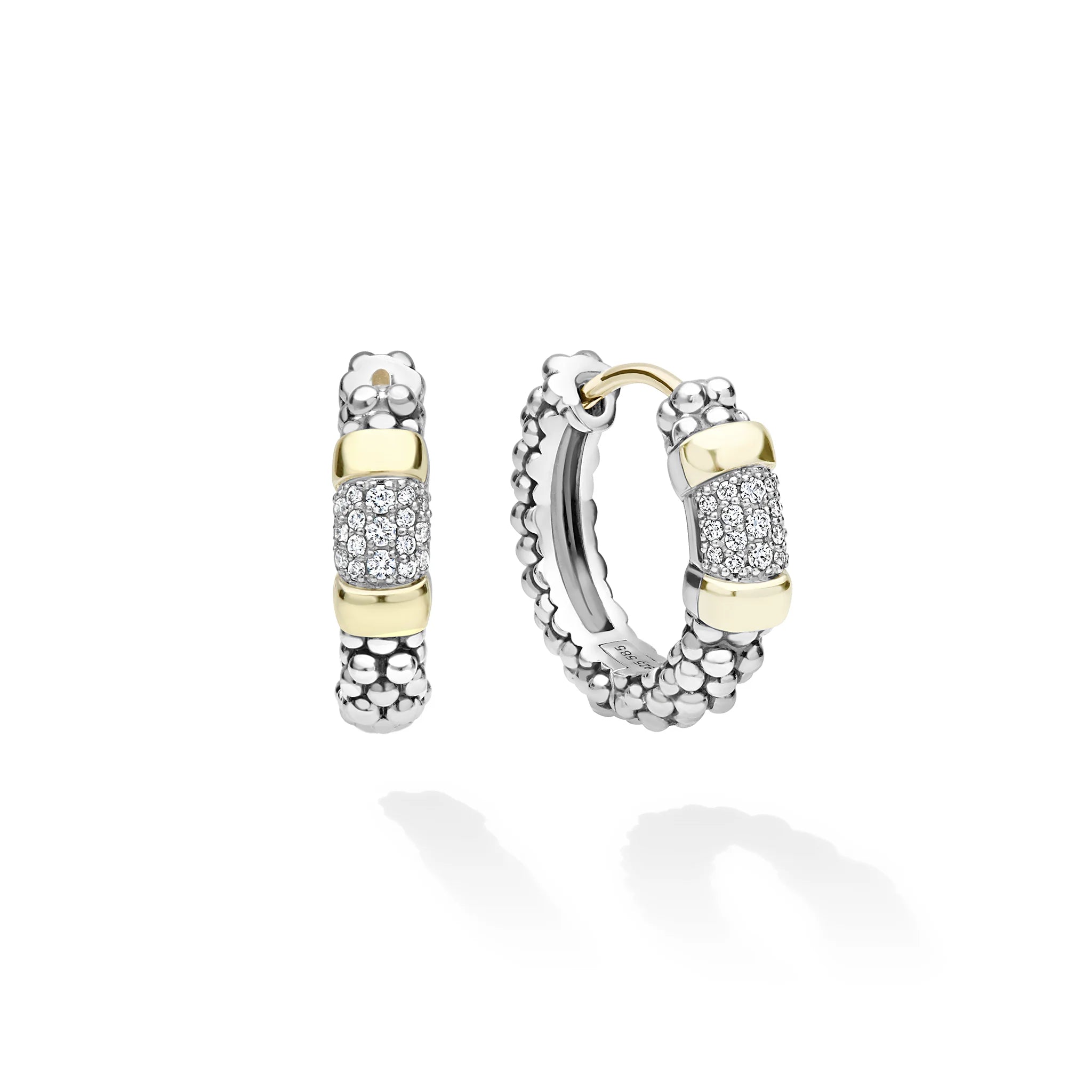 A pair of silver and yellow gold hoop earrings with pavé diamond accents, displayed on a clean white background with soft shadows.
