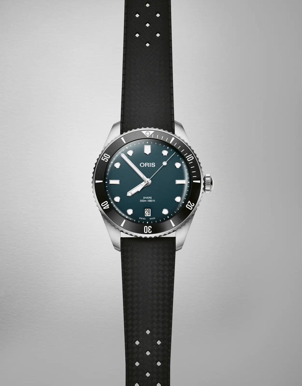 Watch with black strap and blue dial on a gray background