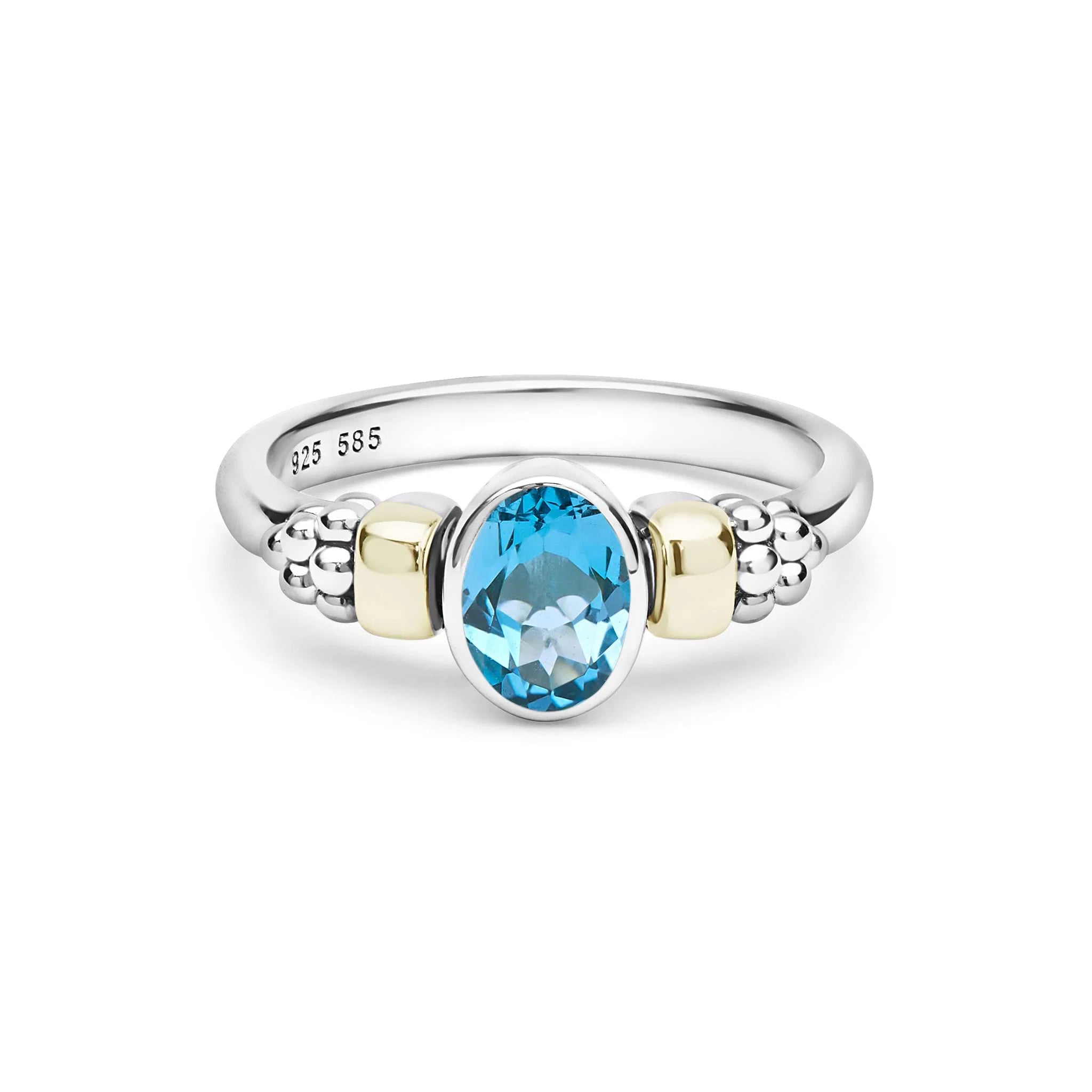 two tone ring with blue oval stone on a white background