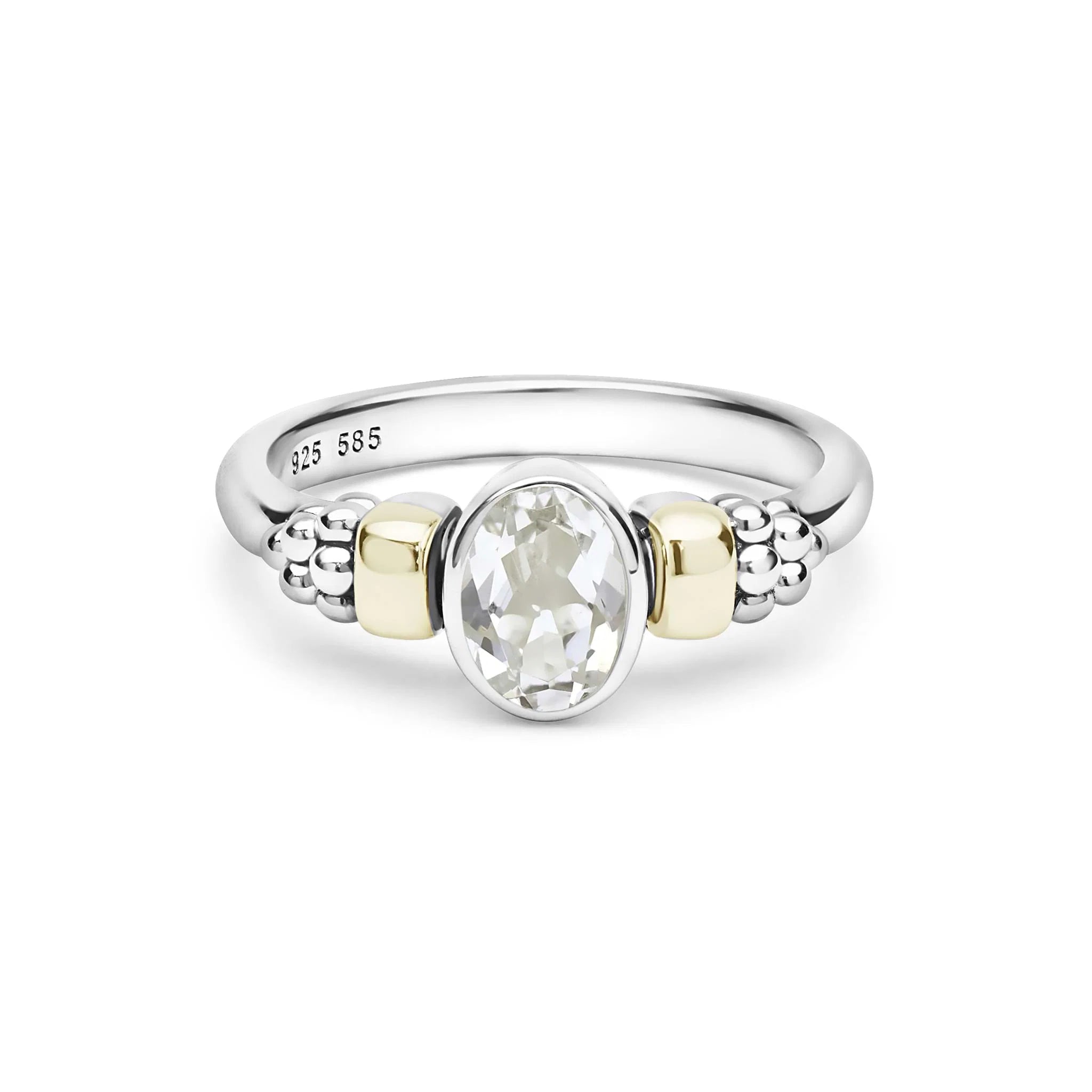 two tone ring with a white topaz oval center stone on a white background