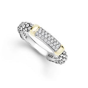 A silver and yellow gold band ring with a pavé diamond center, shown on a clean white background. 