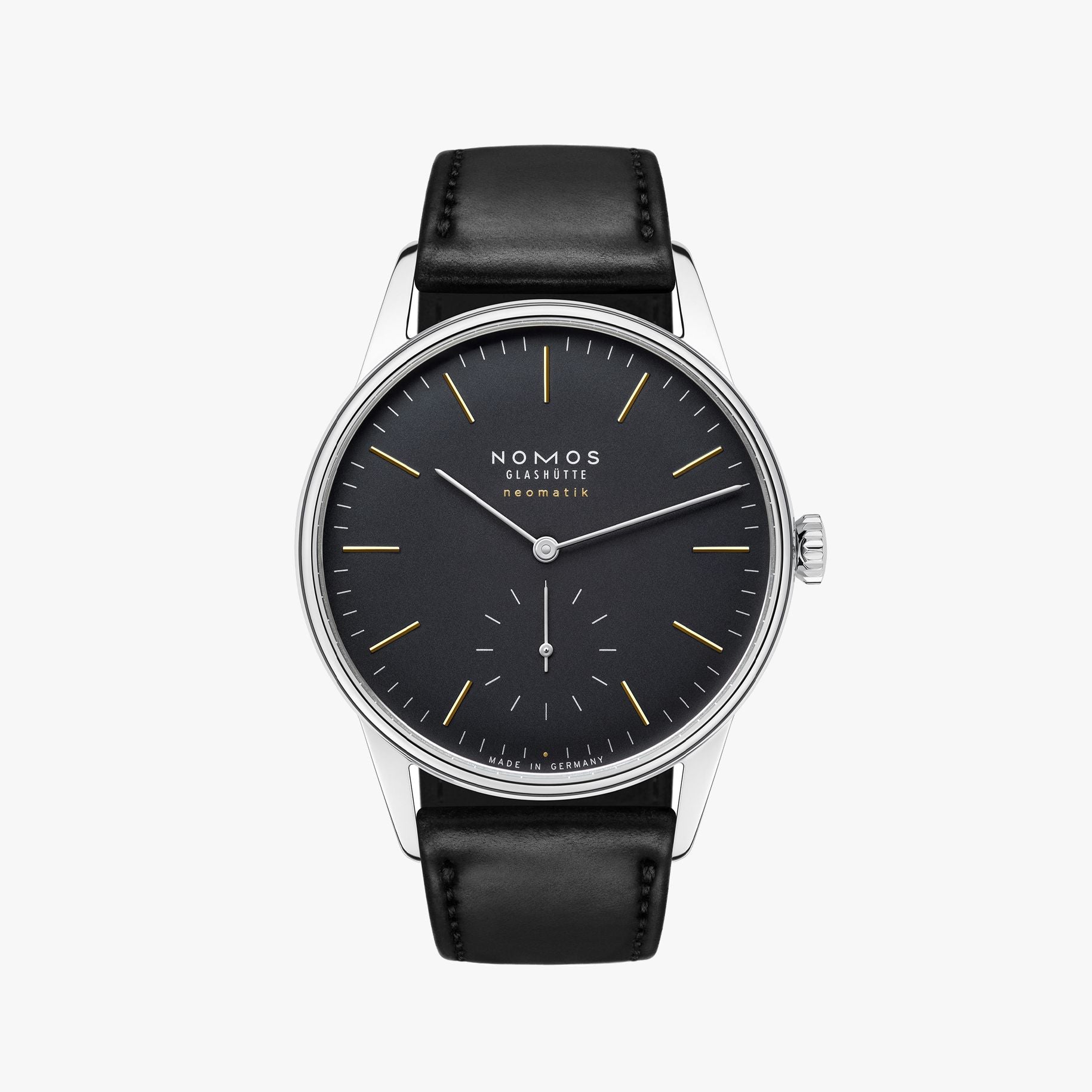 Nomos watch with black dial and leather strap on a white background