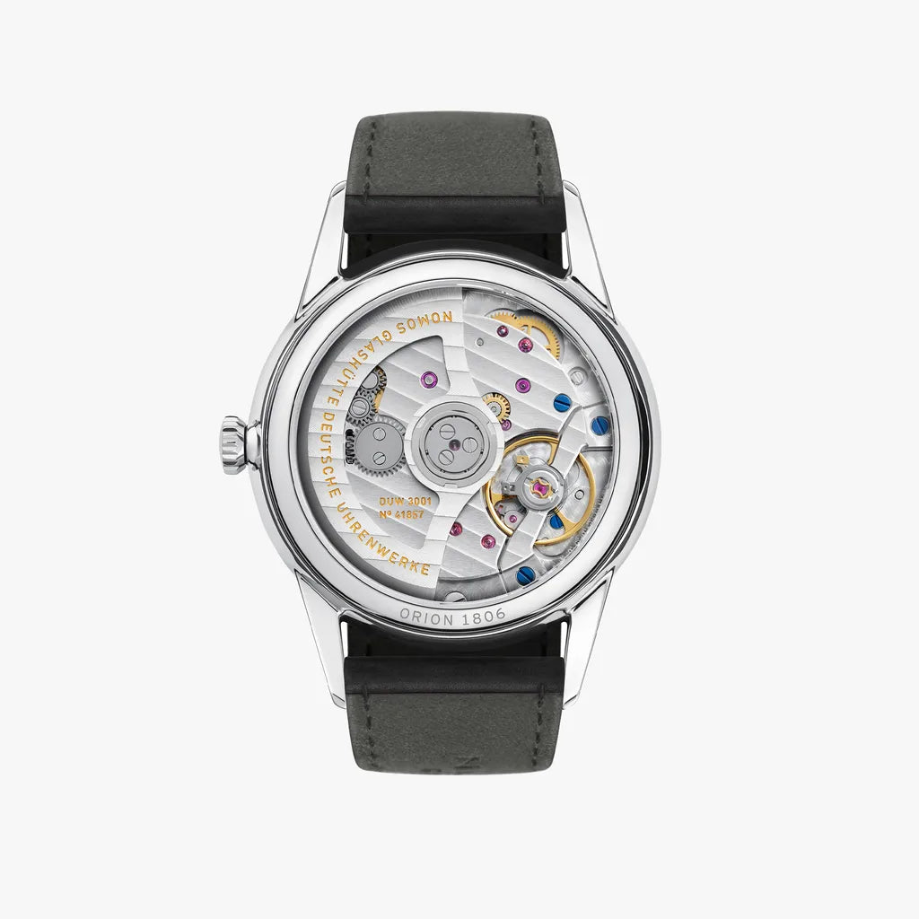 Watch with visible mechanical components on a white background