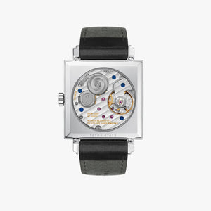 Watch with black leather strap and visible mechanical components on a white background