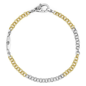 gold and silver tone link bracelet on a white background
