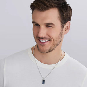 a man wearing a white tshirt and a Small Sterling Silver and Pietersite Tag Amulet on a white background