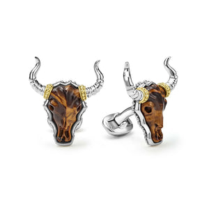 Front and side views of Tiger Eye long horn cufflinks showing carved tiger eye bull skulls set in sterling silver with 18K gold beaded accents on white background