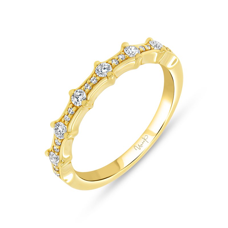 Angled view of 14K yellow gold diamond wedding band showcasing alternating larger and smaller round diamonds along the scalloped top edge with white background