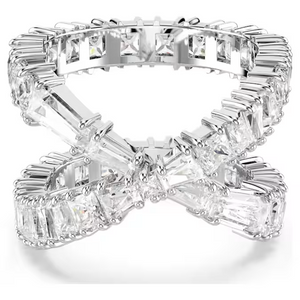 Angled view of Hyperbola Ring showing crisscross infinity design with baguette and square-cut stones in rhodium-plated setting