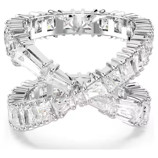 Angled view of Hyperbola Ring showing crisscross infinity design with baguette and square-cut stones in rhodium-plated setting