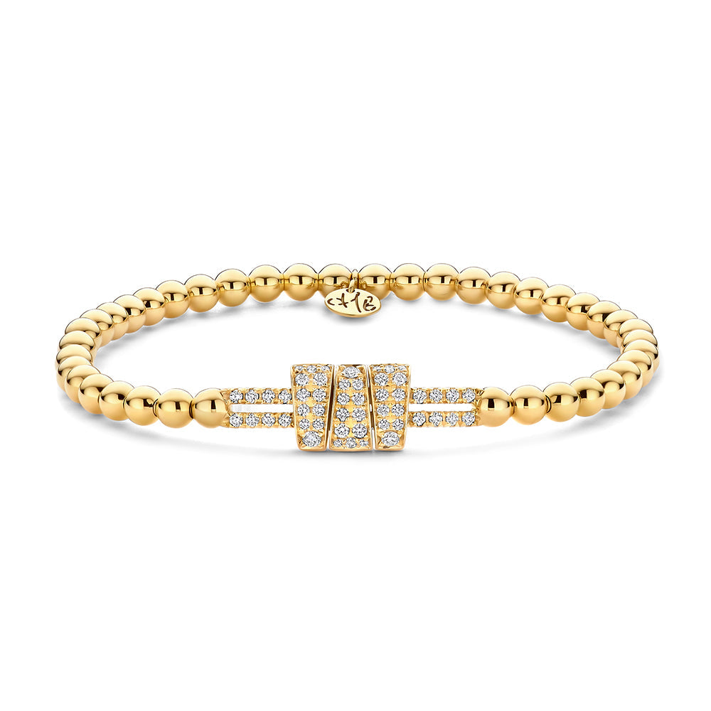 gold beaded bracelet with diamonds on a white background