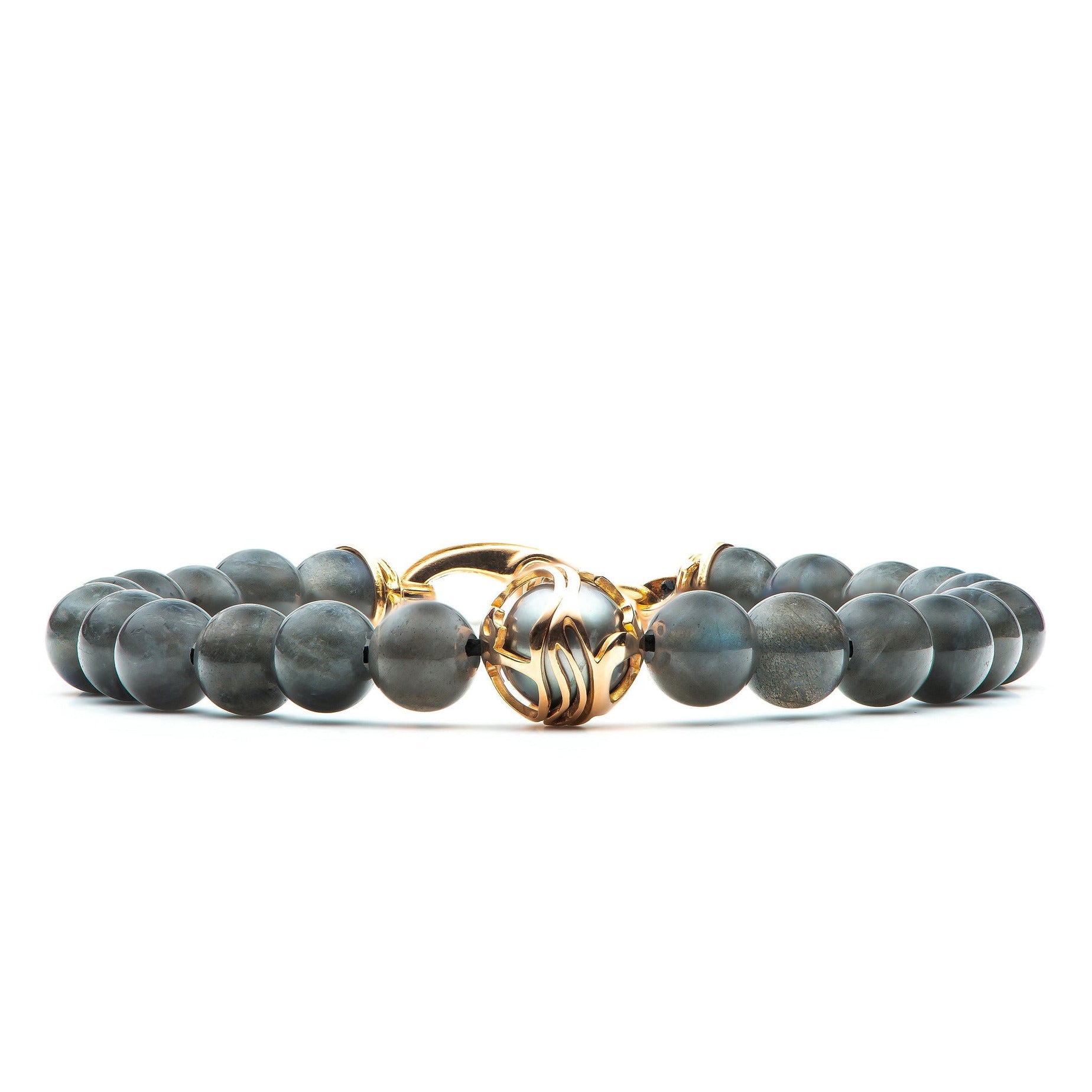 Straight-on view of William Henry Moonlight bracelet with gray beads and gold filigree clasp featuring central pearl on white