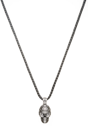 Front view of William Henry Cristobal skull pendant in sterling silver with engraved sugar-skull details on braided chain