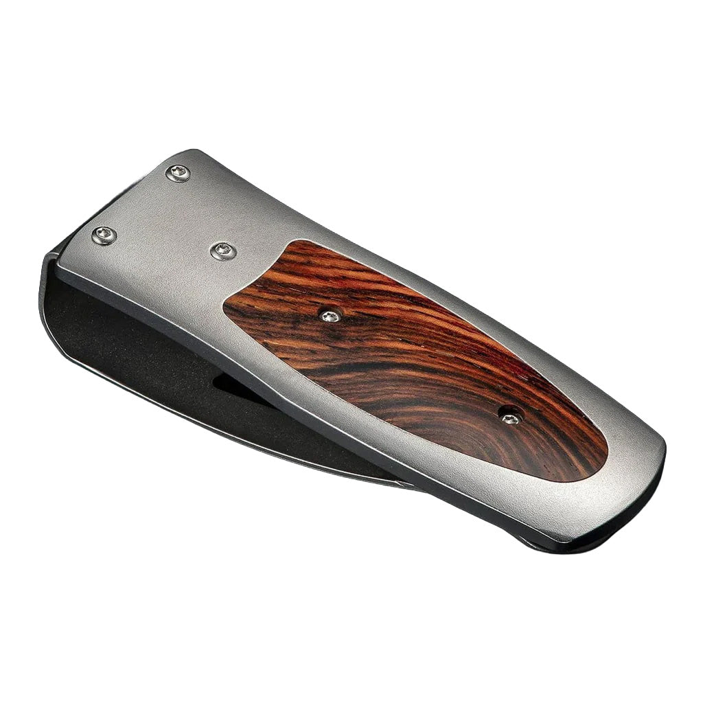 Angled view of William Henry Coco money clip showcasing cocobolo wood inlay and titanium frame on white background