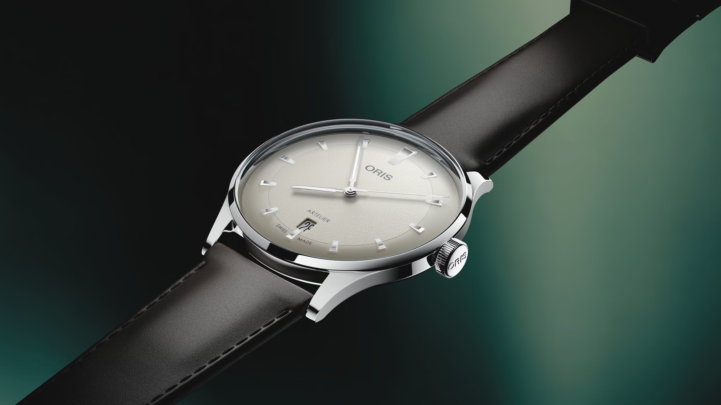 Wristwatch with a black strap and silver case on a gradient background