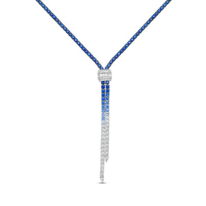A luxury Y-shaped pendant necklace featuring a vibrant blue-to-clear gradient drop. The top section of the drop is paved with deep blue sapphires, while the lower section transitions into clear pavé diamonds.