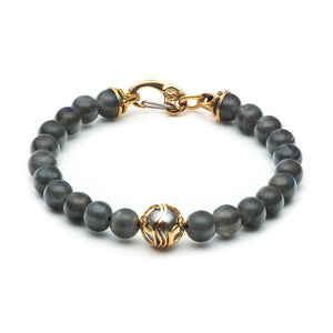 Gray labradorite beaded bracelet with gold filigree center bead and gold lobster clasp