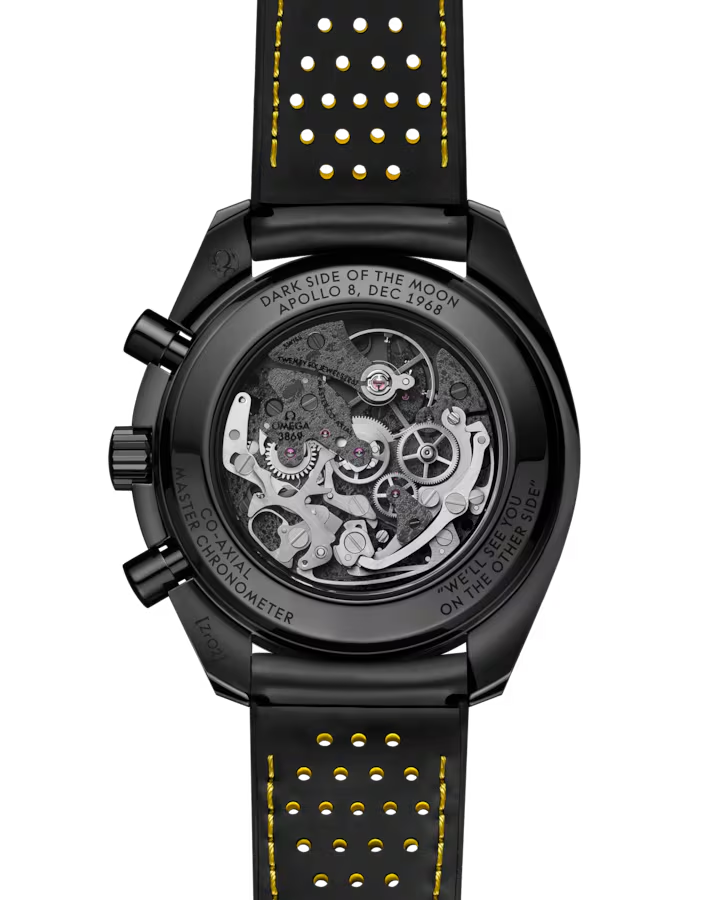 Rear of Speedmaster Dark Side of the Moon 44.25mm showing skeleton movement and black strap with yellow stitching