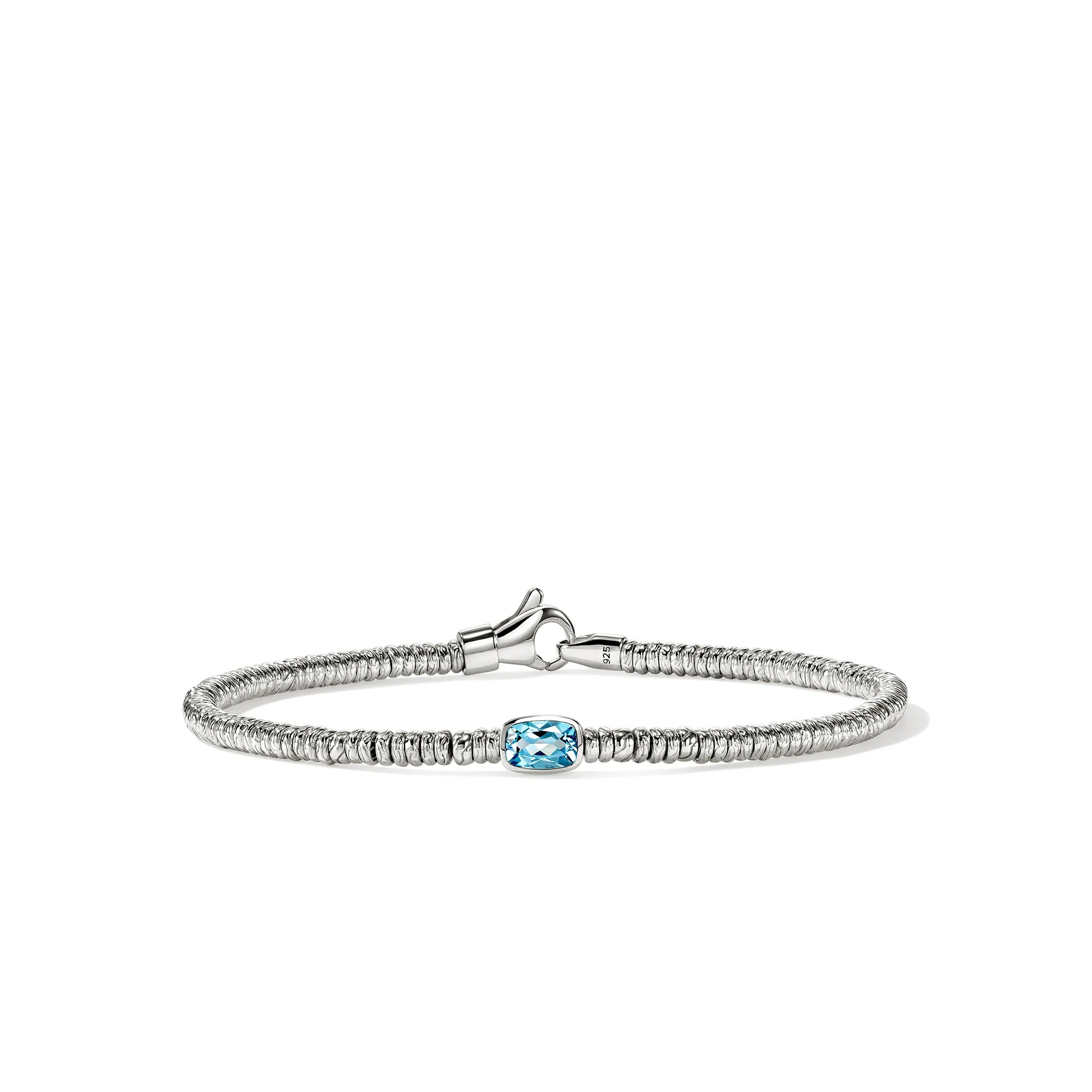 A silver-toned beaded bracelet featuring a central cushion-cut light blue gemstone, displayed on a clean white background.