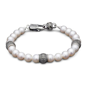Top view of William Henry Full Moon bracelet showing 8mm white freshwater pearls and sterling silver beads on white background