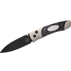 Folding pocket knife with black blade, silver handle with decorative inset and "WH" logo on the blade