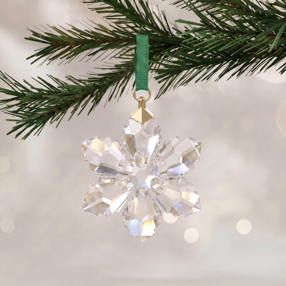 2026 annual edition snowflake hanging from a tree on a white shimmery background