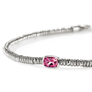 A silver-toned beaded bracelet featuring a central rectangular pink gemstone in a bezel setting, photographed on a clean white background.