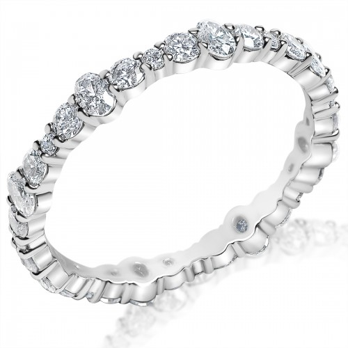 Angled top view of .58ctw oval and round shared-prong eternity band in 14K white gold with alternating diamonds on white