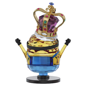 Minion figurine with jeweled crown, faceted crystal-like body, arms raised, on round black base