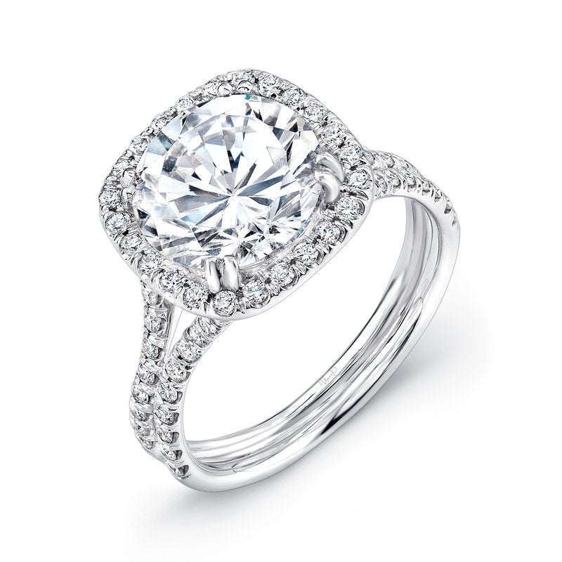 Angled view of .60ctw halo engagement ring with large round center stone, cushion halo and pave split shank