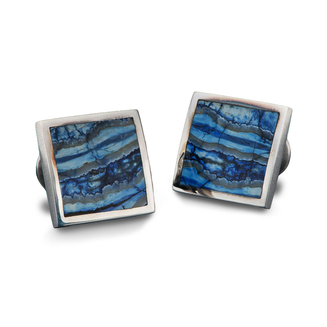 Front view of William Henry Blue Mammoth cufflinks showcasing blue fossil inlays and square sterling frames on white background
